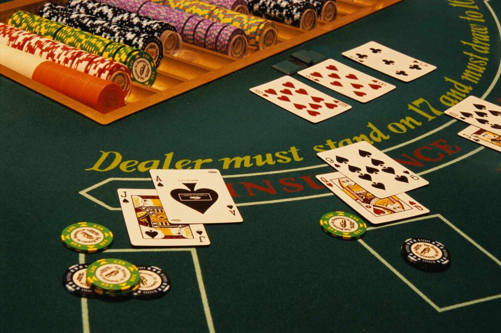 winning-blackjack-hand-on-casino-table-520257696-58979c263df78caebc19a6e7
