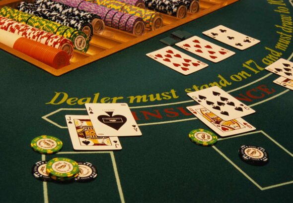 winning-blackjack-hand-on-casino-table-520257696-58979c263df78caebc19a6e7